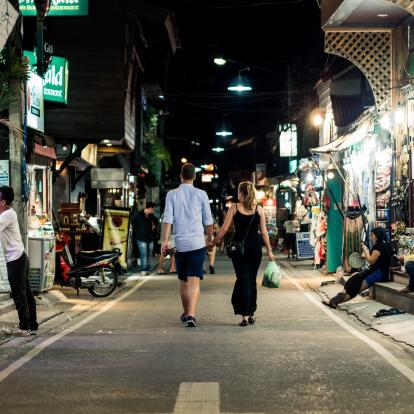 Couples walking through Asia market