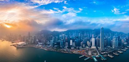 Aerial view of Hong Kong Island with sunlight beaming through