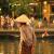 A woman in a conical hat in Hoi An