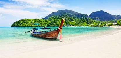 Boat on a gorgeous sunny dain in Ko Phi Phi Island in Thailand