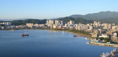 Beautiful sunset view of South Kora's Sokcho harbour, with both boats and buildings visible