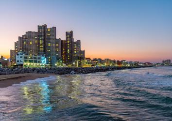 Skyline of Sokcho behind the sea at sunset