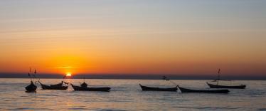 Boats on the Irrawaddy River at sunset