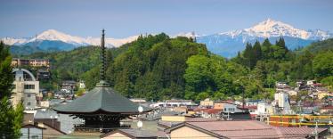 Rooftops of Takayama with snow-capped Mount Fuji in the background