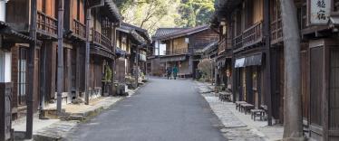 Wooden buildings lining street in Tsumago, Japan