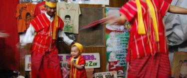 Lu Zaw performing with family members at the Moustache Brothers' home