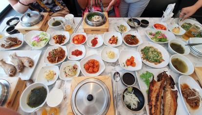 An assortment of side dishes are displayed on a table in South Korea, also known as banchan