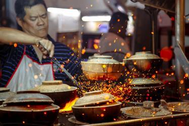 Cooking street food in Kuala Lumpur