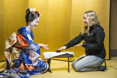 Playing drinking games with a maiko in a yellow room in Kyoto