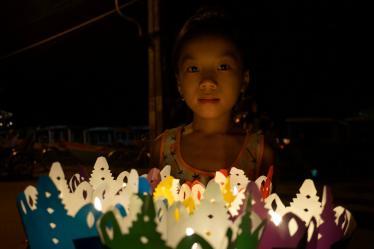 Child selling lanterns at the festival