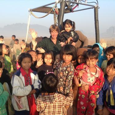 Ali in hot air balloon with local children in Burma